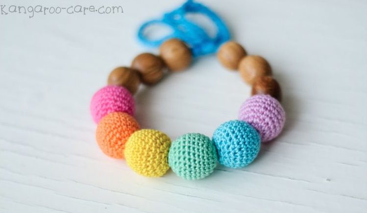 Kangura portabebés Pulseras Kangaroocare dentición Aqua Rainbow